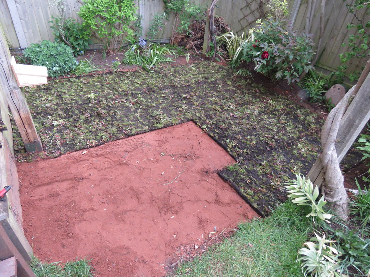 Laying the wild flower meadow turf.