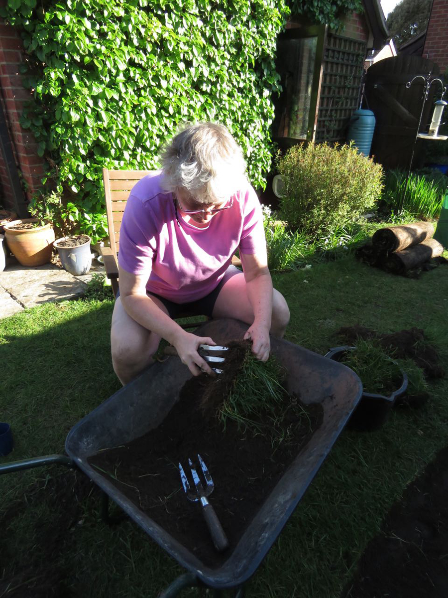 Removing the lawn turf.